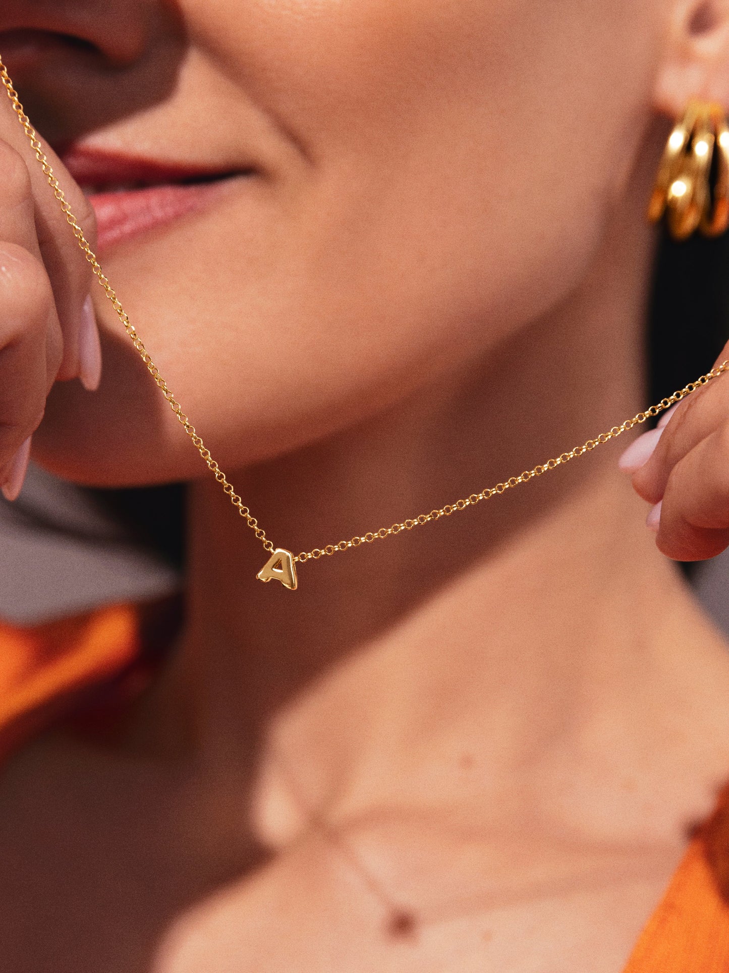 Gouden ketting met gepersonaliseerd initiaal